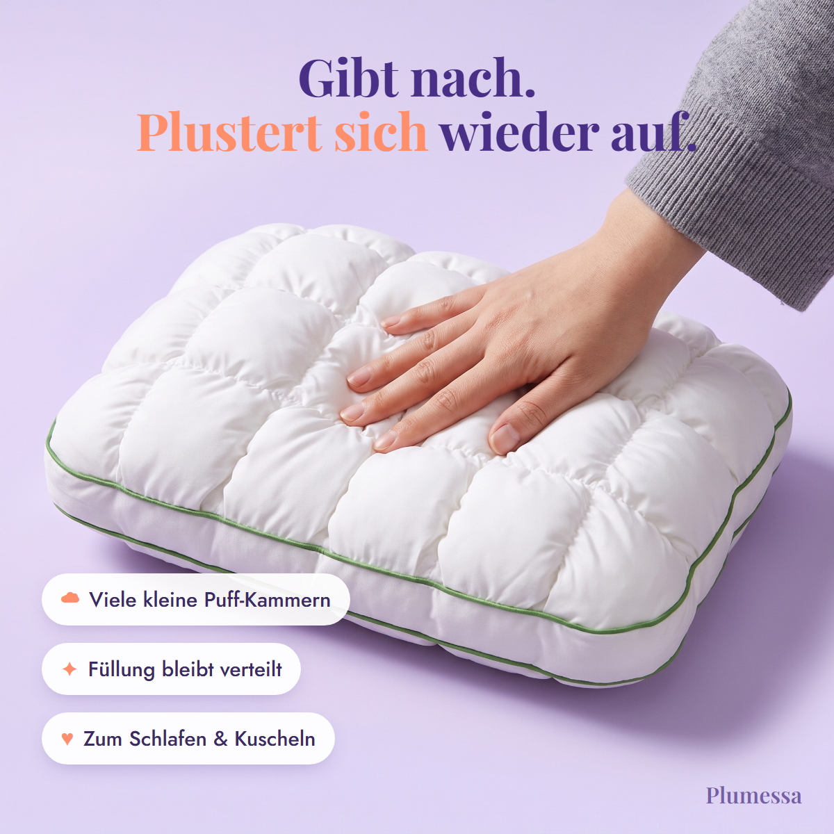 Hand drückt in das weiche Marshmallow-Kissen